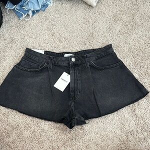 High-rise pleated denim Shorts